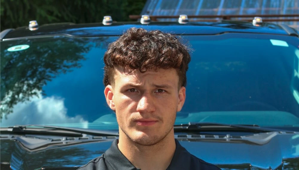 Jakub Miklus in front of his truck